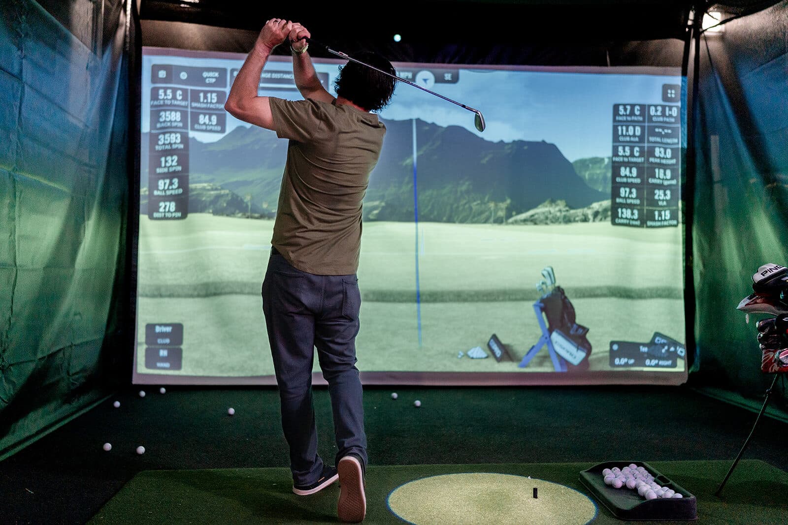 Gargoyle House four-car garage converted to a golf simulator clubhouse