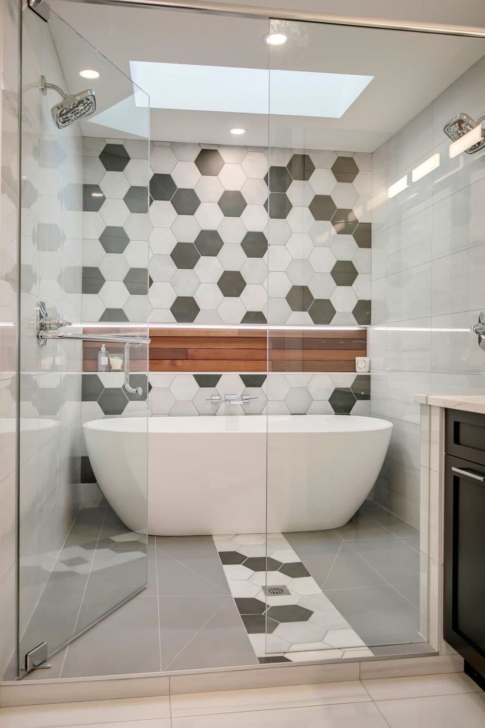 Freestanding tub with patterned tile feature wall — Lake Lucerne
