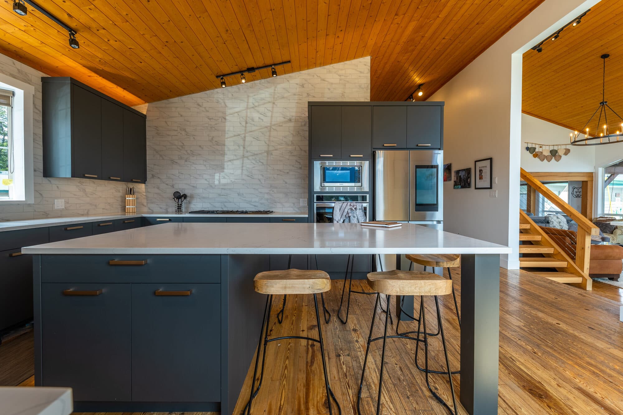 Reimagine Ranch kitchen with vaulted wood ceiling and quartz island