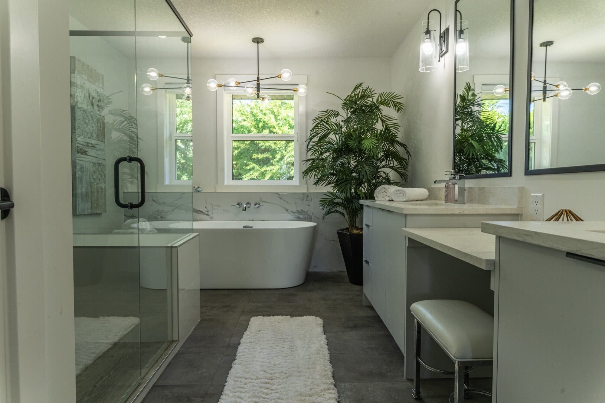 Spa-like primary bathroom with freestanding tub and walk-in shower