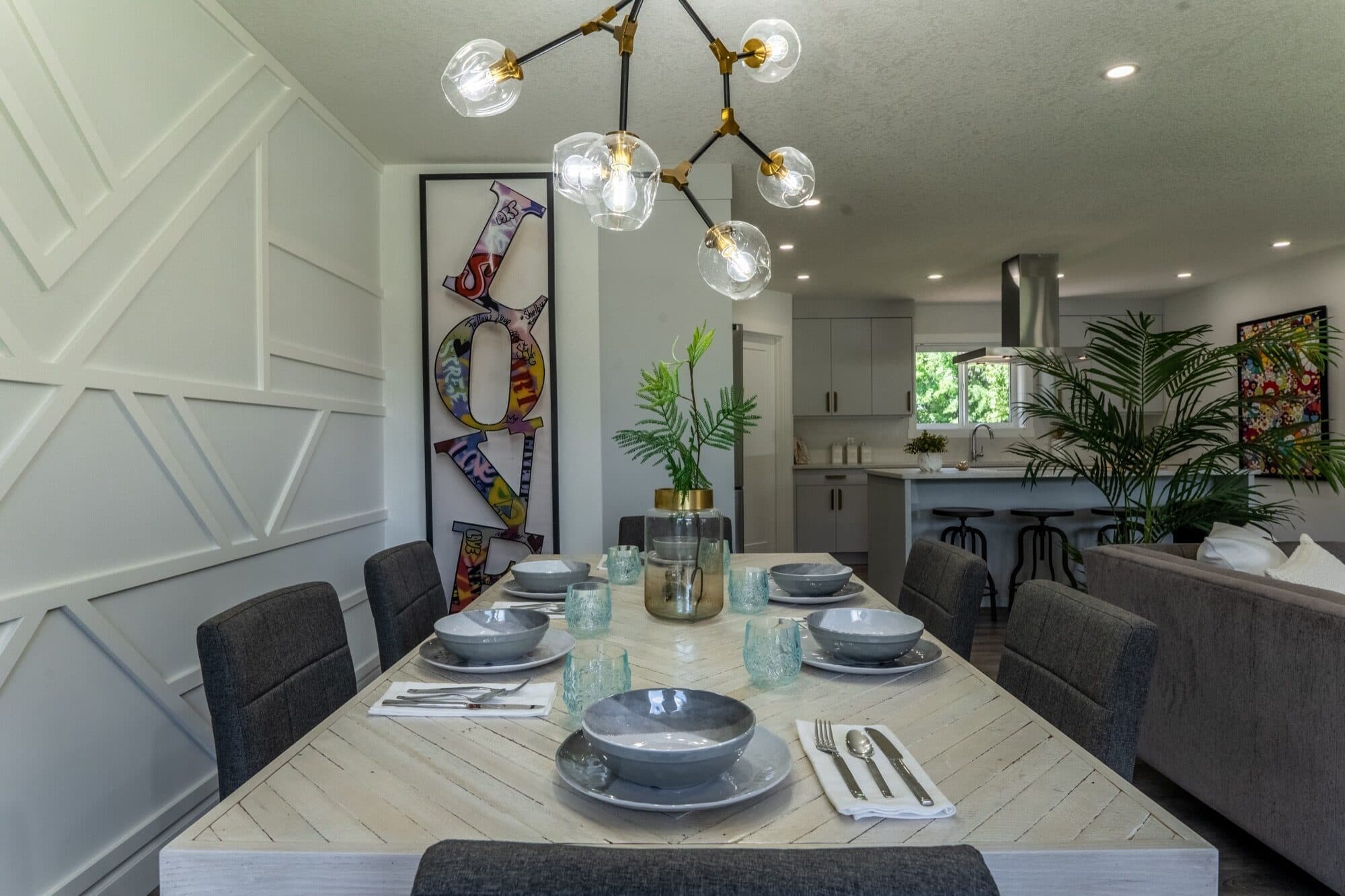 Legal suite dining room with open kitchen and chandelier