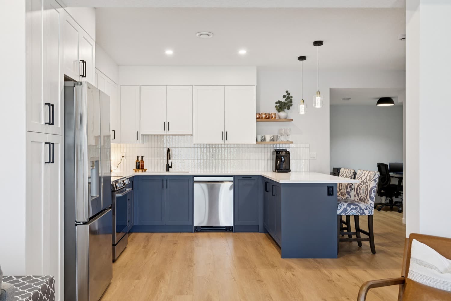 Legal suite kitchen with navy island, quartz counters and full-size appliances