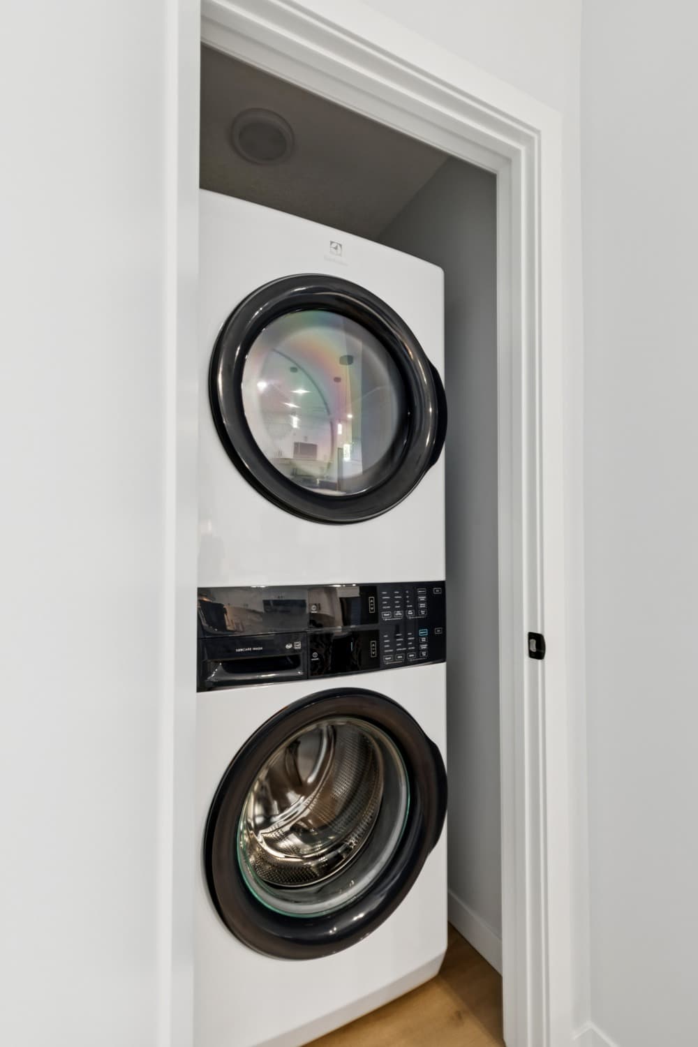 Stacked in-suite washer and dryer in a legal basement suite