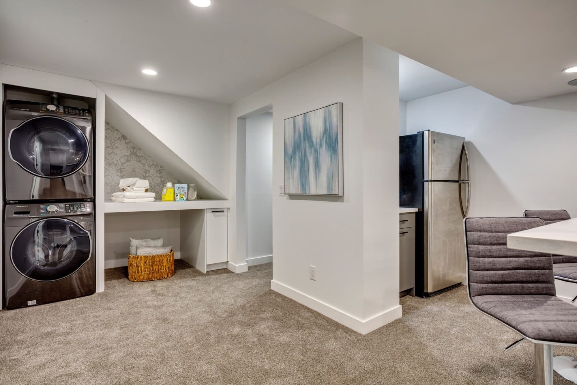 Legal suite kitchen area with stacked laundry and open plan