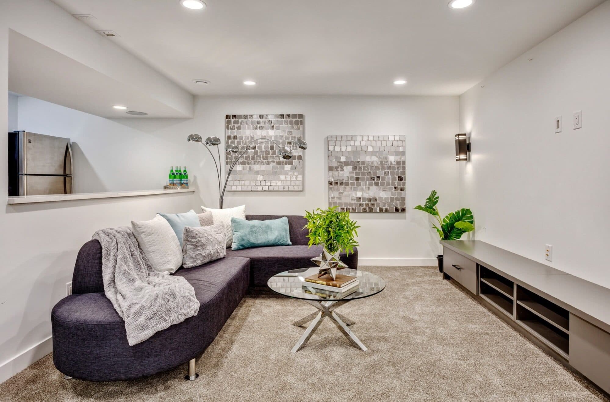 Legal suite living room with sectional sofa and open kitchen