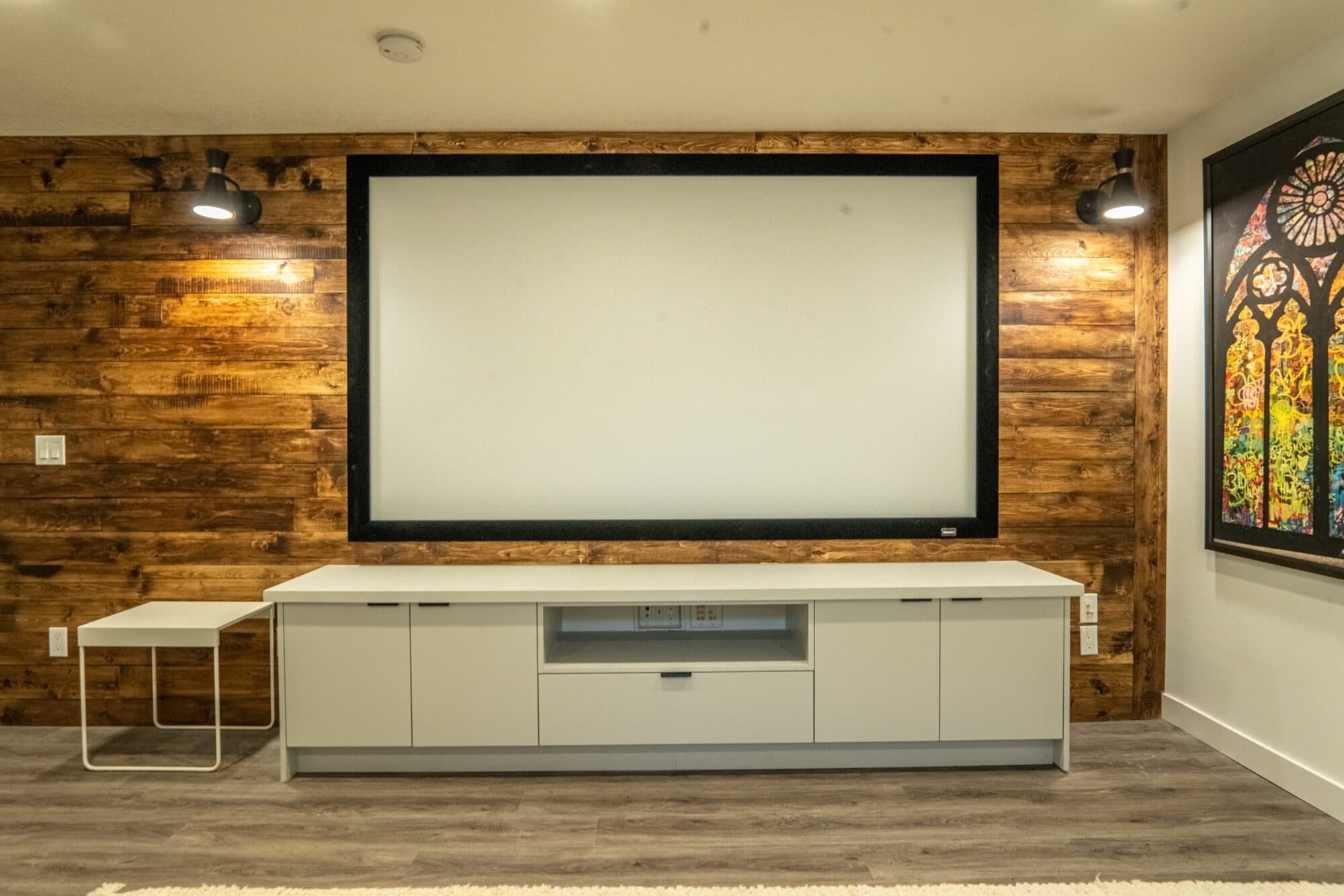 Rustic reclaimed-wood home theatre wall with projection screen