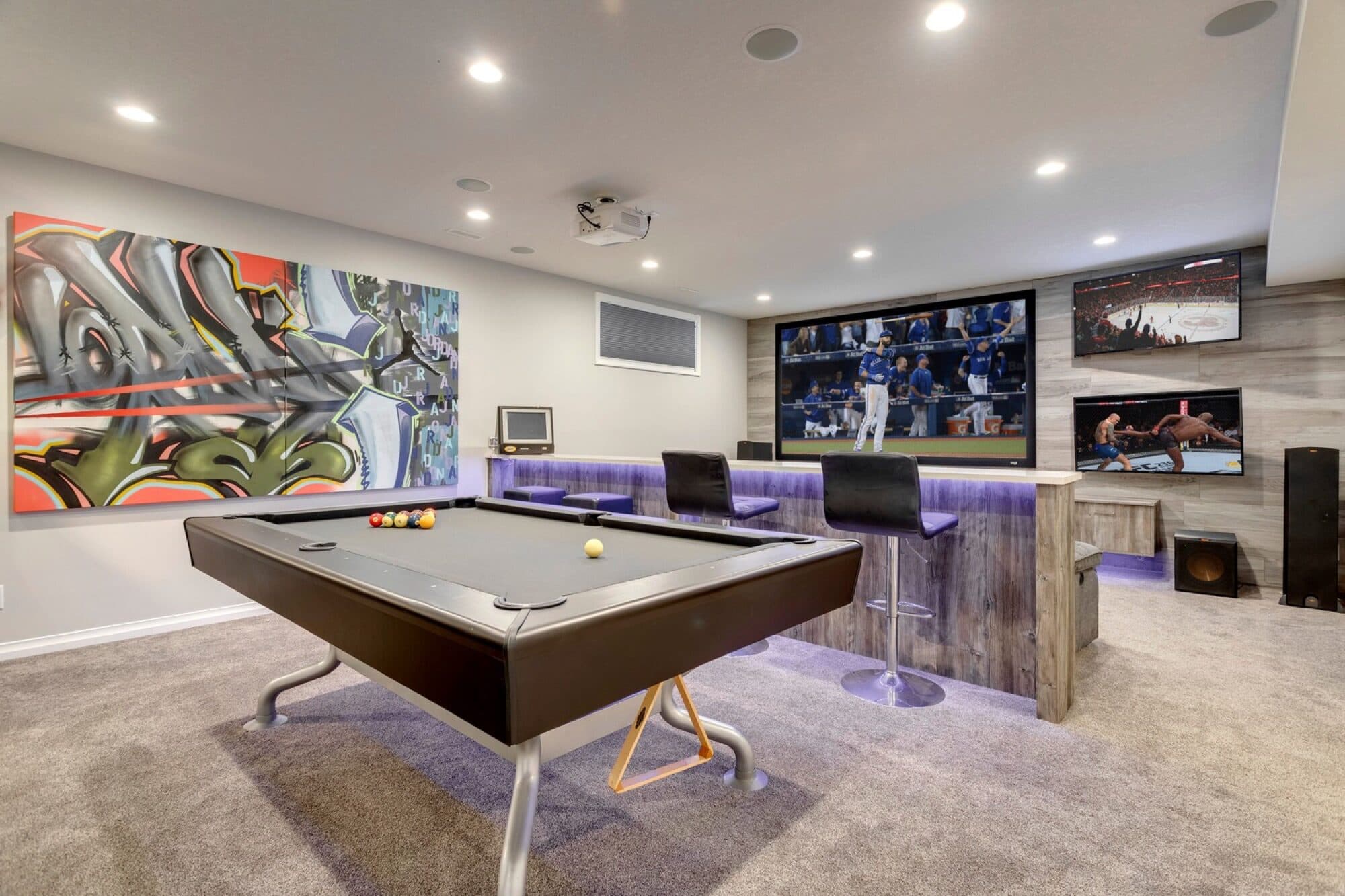 Basement bar and pool table wide angle with projector screen