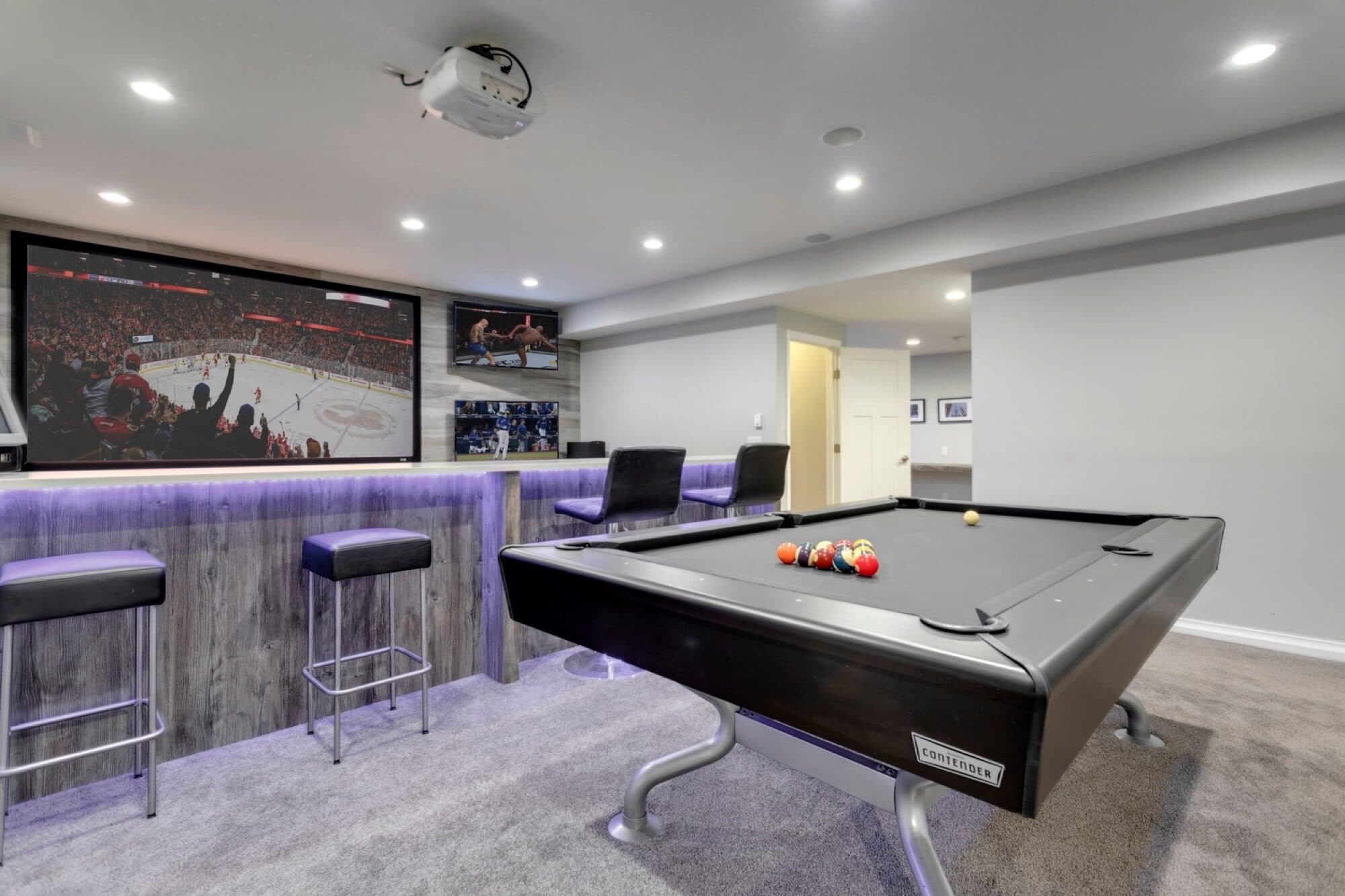 Basement wet bar with reclaimed wood shelves and wine fridge