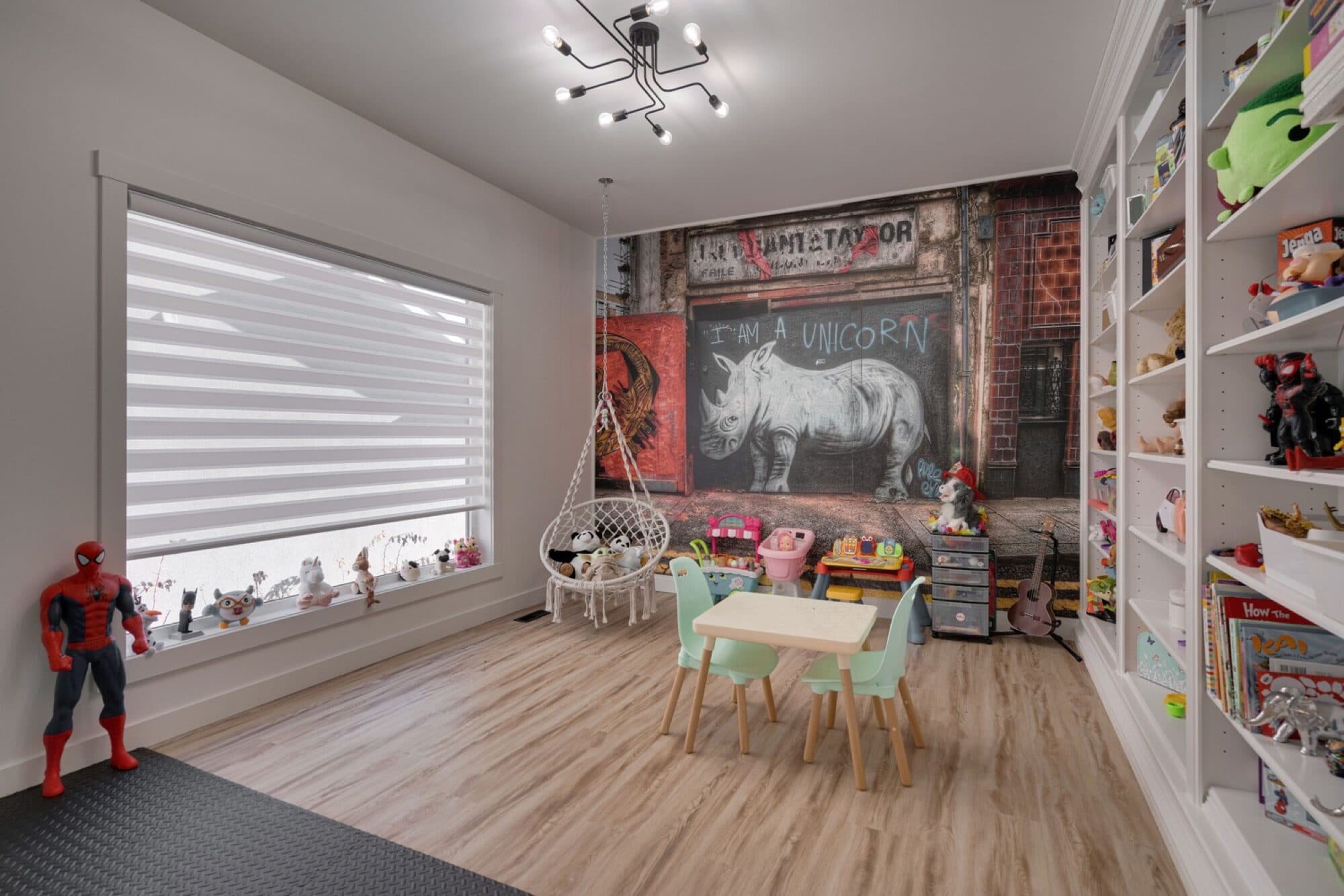 Playroom with mural feature wall and toy storage