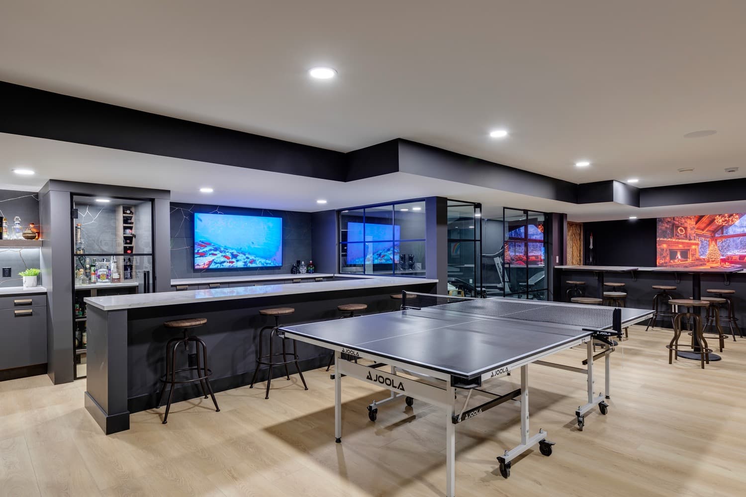 Finished Calgary basement with bar, games area and media wall